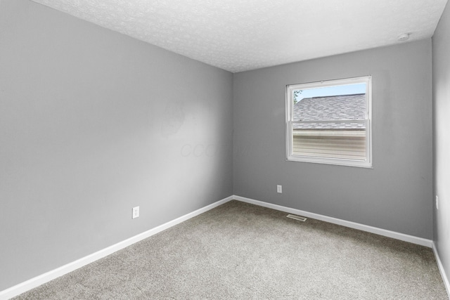 2483 Onyx Ct, Grove City, OH 43123 - carpeted spare room with baseboards and a textured ceiling