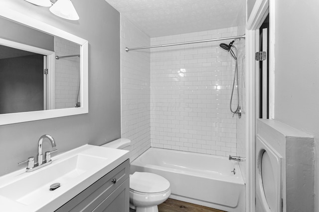 2483 Onyx Ct, Grove City, OH 43123 - bathroom featuring vanity, bathing tub / shower combination, a textured ceiling, and wood finished floors