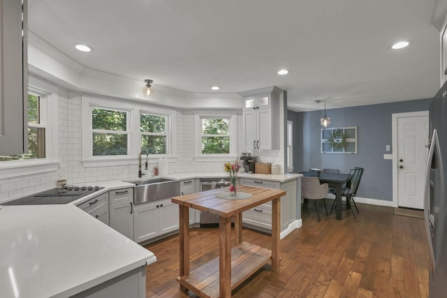 10 Denbigh Dr, Granville, OH 43023 - kitchen with stainless steel appliances, backsplash, healthy amount of natural light, and recessed lighting