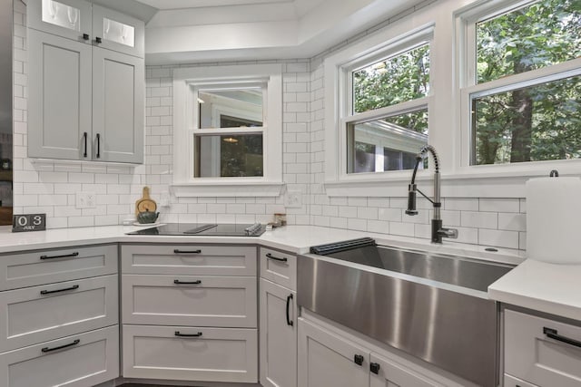 10 Denbigh Dr, Granville, OH 43023 - kitchen with backsplash, light countertops, and black electric cooktop