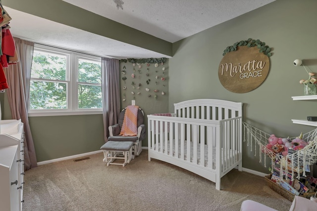10 Denbigh Dr, Granville, OH 43023 - carpeted bedroom with a textured ceiling and a crib
