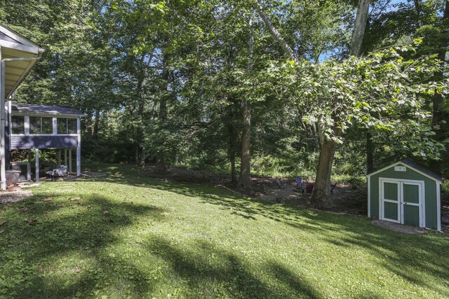 10 Denbigh Dr, Granville, OH 43023 - view of grassy yard with a storage unit and a sunroom