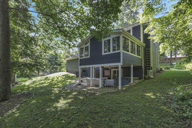 10 Denbigh Dr, Granville, OH 43023 - back of house with a lawn, a sunroom, and cooling unit