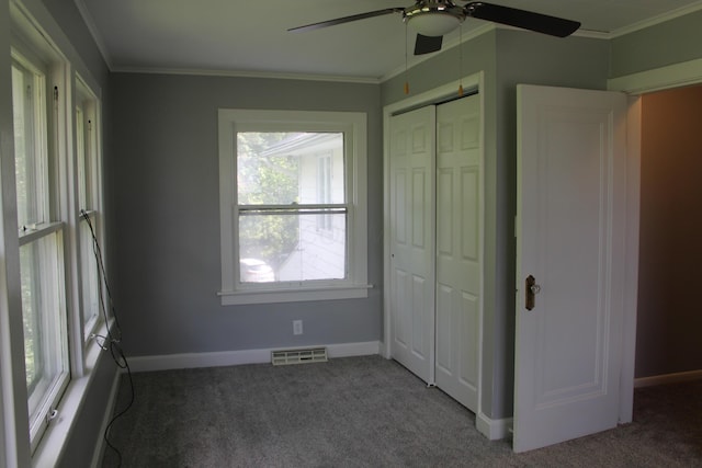 193 E Walnut St, Marion, OH 43302 - unfurnished bedroom featuring carpet, crown molding, a closet, and ceiling fan