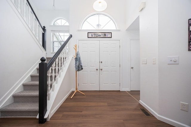 4247 Boulder Creek Dr, Columbus, OH 43230 - entrance foyer with wood finished floors, stairway, and a towering ceiling
