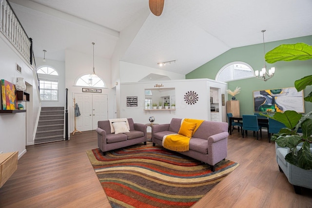 4247 Boulder Creek Dr, Columbus, OH 43230 - living area featuring a chandelier, wood finished floors, stairs, plenty of natural light, and high vaulted ceiling