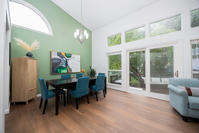 4247 Boulder Creek Dr, Columbus, OH 43230 - dining space featuring high vaulted ceiling, a chandelier, wood finished floors, and healthy amount of natural light