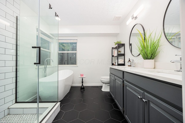 4247 Boulder Creek Dr, Columbus, OH 43230 - full bathroom featuring double vanity, a soaking tub, a stall shower, tile patterned flooring, and a textured ceiling