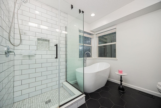 4247 Boulder Creek Dr, Columbus, OH 43230 - full bathroom with a soaking tub, a stall shower, tile patterned floors, a textured ceiling, and recessed lighting