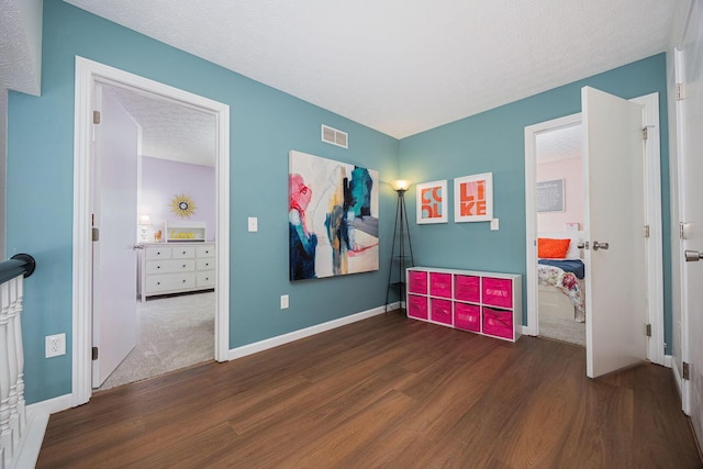 4247 Boulder Creek Dr, Columbus, OH 43230 - bedroom with wood finished floors and a textured ceiling