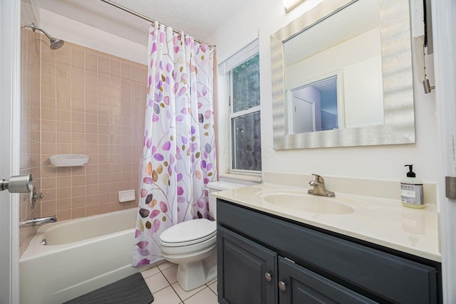 4247 Boulder Creek Dr, Columbus, OH 43230 - full bathroom with vanity, tile patterned floors, shower / bath combo, and a textured ceiling