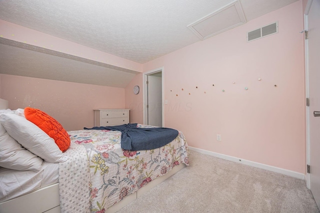 4247 Boulder Creek Dr, Columbus, OH 43230 - bedroom featuring attic access, a textured ceiling, carpet floors, and vaulted ceiling