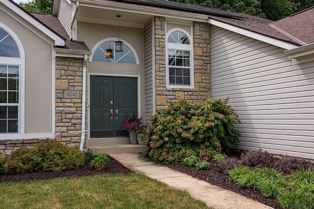 4247 Boulder Creek Dr, Columbus, OH 43230 - doorway to property featuring stone siding and a shingled roof