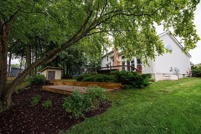 4247 Boulder Creek Dr, Columbus, OH 43230 - view of grassy yard with a deck and a storage unit