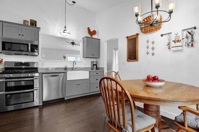 3007 Galen Ct, Hilliard, OH 43026 - kitchen featuring appliances with stainless steel finishes, gray cabinetry, a chandelier, and ceiling fan