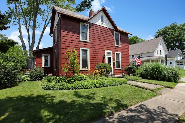 604 Elm St, Groveport, OH 43125 - view of front of property with a chimney and a front lawn