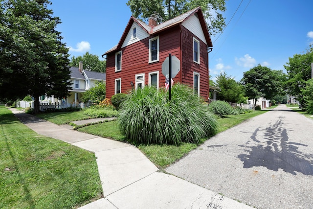 604 Elm St, Groveport, OH 43125 - view of front facade featuring a front lawn and a chimney