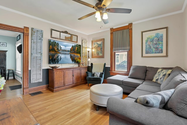 604 Elm St, Groveport, OH 43125 - living room with light wood-style floors, a ceiling fan, ornamental molding, and plenty of natural light