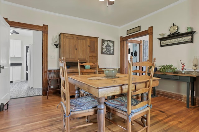 604 Elm St, Groveport, OH 43125 - dining room with crown molding, light wood-style floors, and a ceiling fan