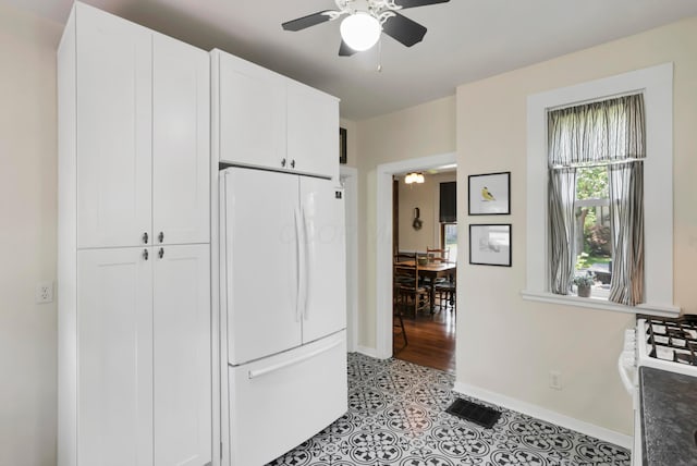604 Elm St, Groveport, OH 43125 - kitchen featuring white appliances, a ceiling fan, white cabinetry, and light tile patterned floors