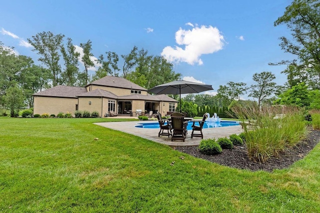 3150 Middle Pike, West Jefferson, OH 43162 - rear view of property with a patio, a lawn, an outdoor pool, and stucco siding