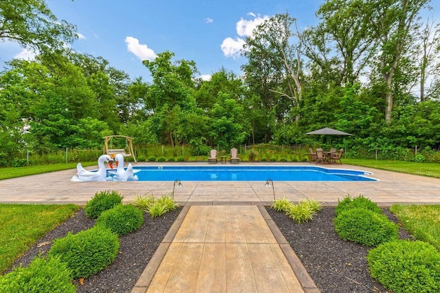 3150 Middle Pike, West Jefferson, OH 43162 - swimming pool with a patio area and view of wooded area