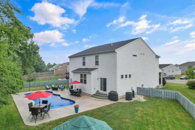 2267 Holiday Valley Dr, Grove City, OH 43123 - rear view of house featuring entry steps, a patio, a fenced backyard, and outdoor dining space