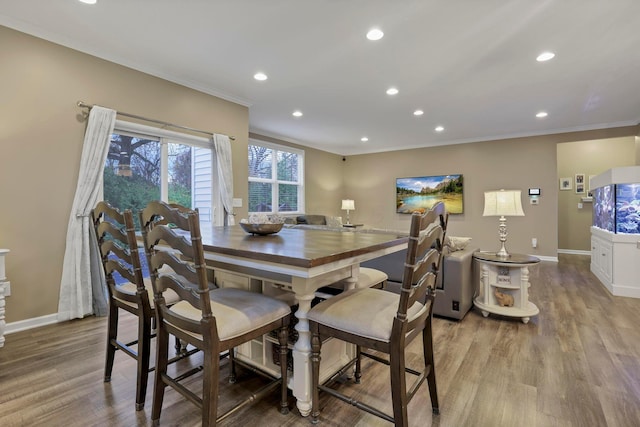 2267 Holiday Valley Dr, Grove City, OH 43123 - dining space featuring ornamental molding, recessed lighting, and wood finished floors
