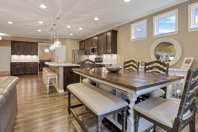 2267 Holiday Valley Dr, Grove City, OH 43123 - dining area featuring recessed lighting, crown molding, and light wood finished floors