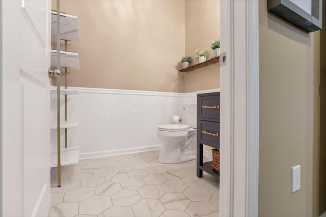 2267 Holiday Valley Dr, Grove City, OH 43123 - bathroom featuring a wainscoted wall and toilet