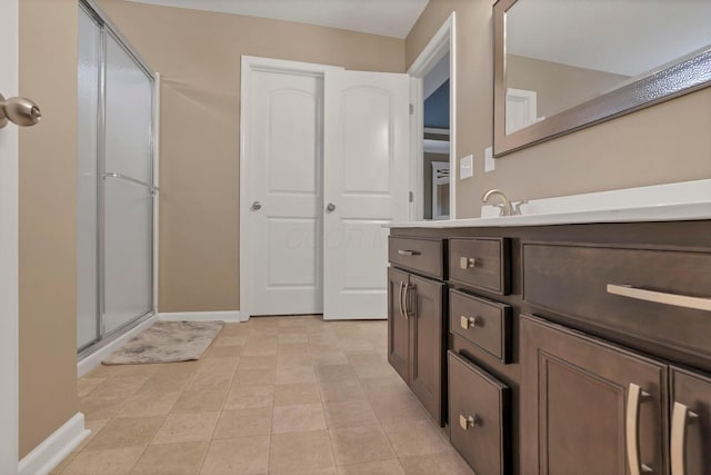 2267 Holiday Valley Dr, Grove City, OH 43123 - bathroom with vanity, an enclosed shower, and tile patterned floors