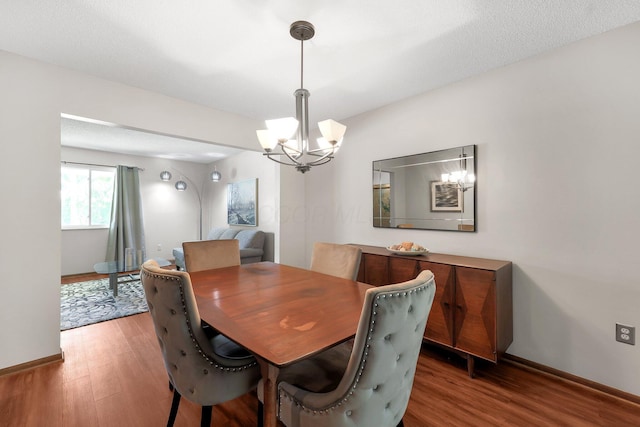 8547 Seabright Dr, Powell, OH 43065 - dining space featuring a chandelier and wood finished floors