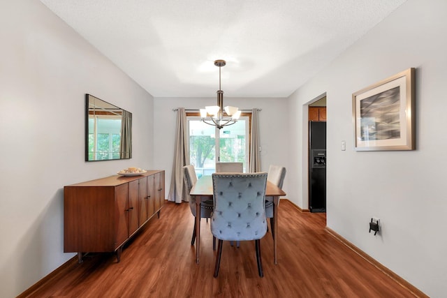 8547 Seabright Dr, Powell, OH 43065 - dining room with a chandelier and wood finished floors
