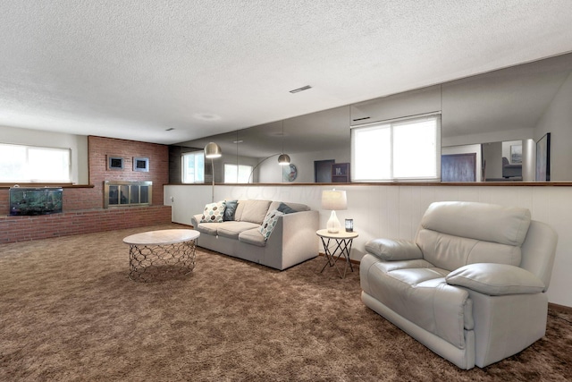 8547 Seabright Dr, Powell, OH 43065 - living room with carpet floors, a textured ceiling, a fireplace, and brick wall