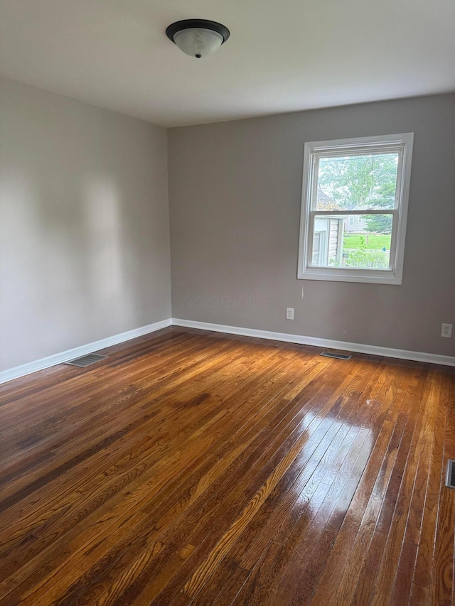 5542 Emerson Ave, Worthington, OH 43085 - empty room with dark wood-type flooring and baseboards