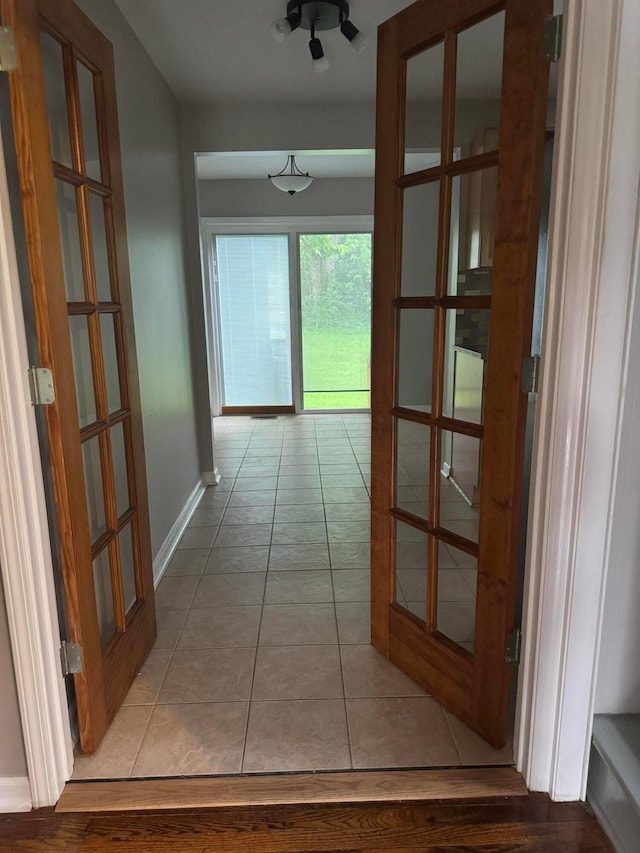 5542 Emerson Ave, Worthington, OH 43085 - hall featuring light tile patterned flooring and french doors