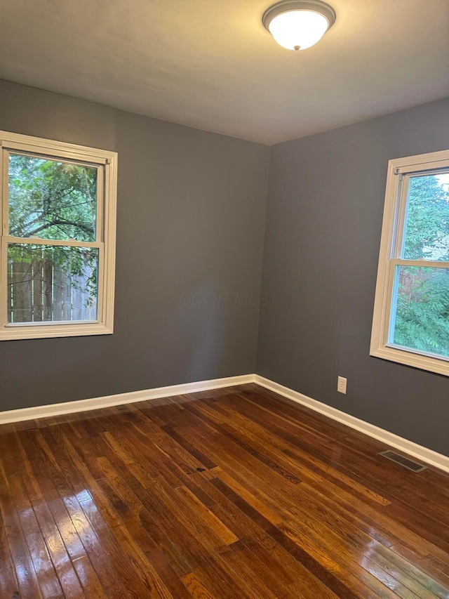 5542 Emerson Ave, Worthington, OH 43085 - spare room with dark wood-style floors