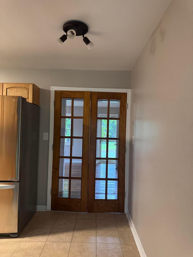5542 Emerson Ave, Worthington, OH 43085 - doorway to outside featuring light tile patterned floors and french doors