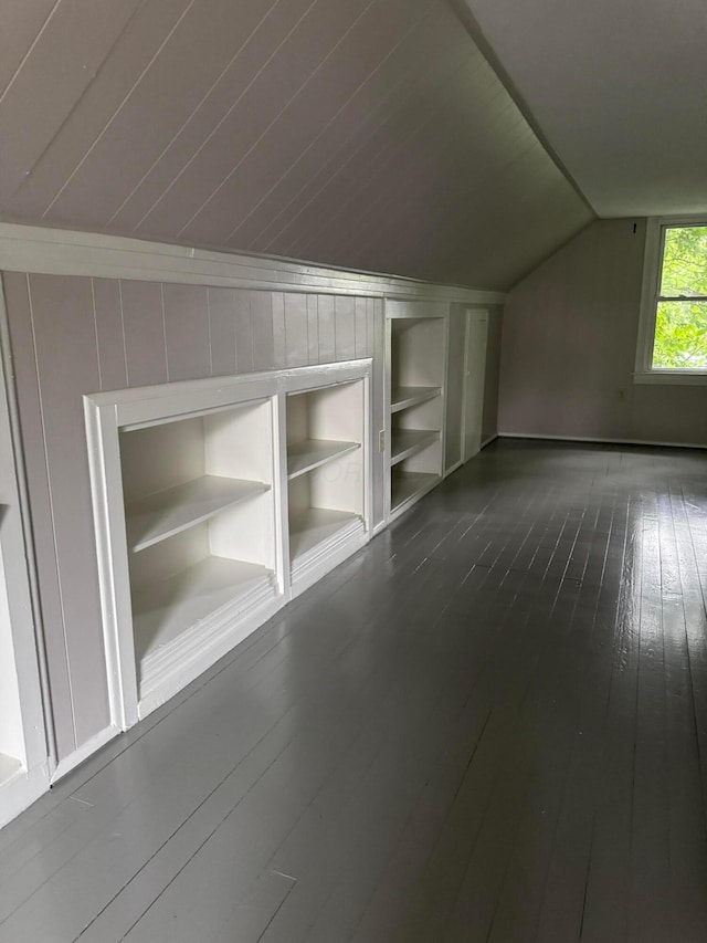 5542 Emerson Ave, Worthington, OH 43085 - bonus room featuring built in features, vaulted ceiling, and dark wood finished floors