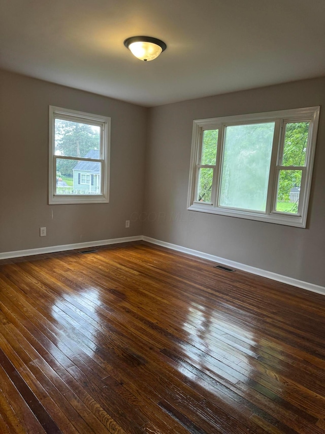 5542 Emerson Ave, Worthington, OH 43085 - spare room featuring healthy amount of natural light and dark wood-style flooring