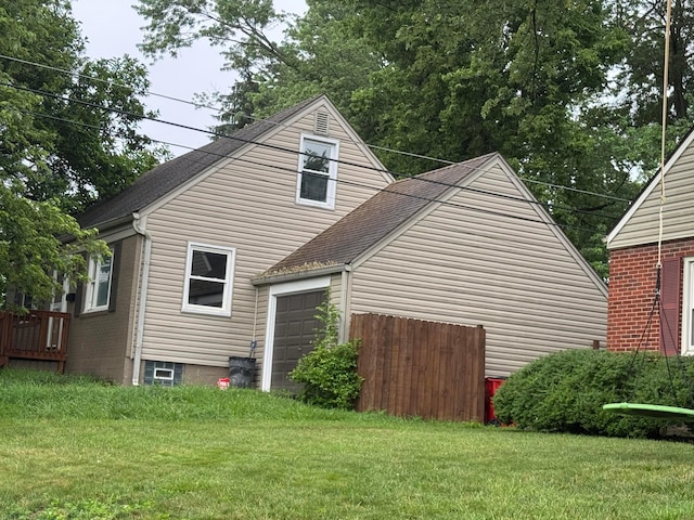 5542 Emerson Ave, Worthington, OH 43085 - view of side of property with a yard, roof with shingles, and a garage