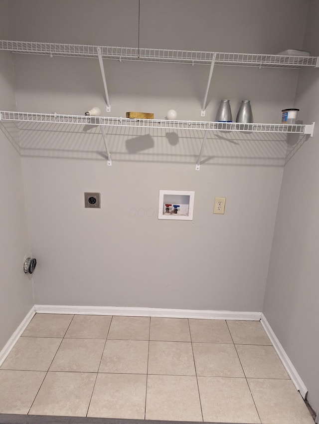 6679 Brock St, Dublin, OH 43017 - laundry room featuring electric dryer hookup, washer hookup, and tile patterned flooring