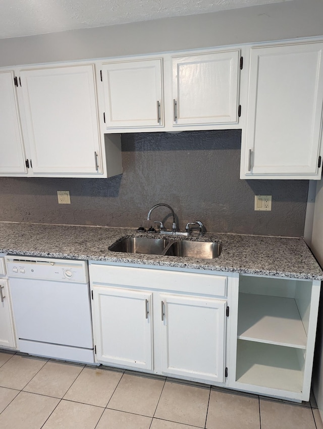 6679 Brock St, Dublin, OH 43017 - kitchen featuring white dishwasher, light tile patterned floors, white cabinetry, and stone countertops