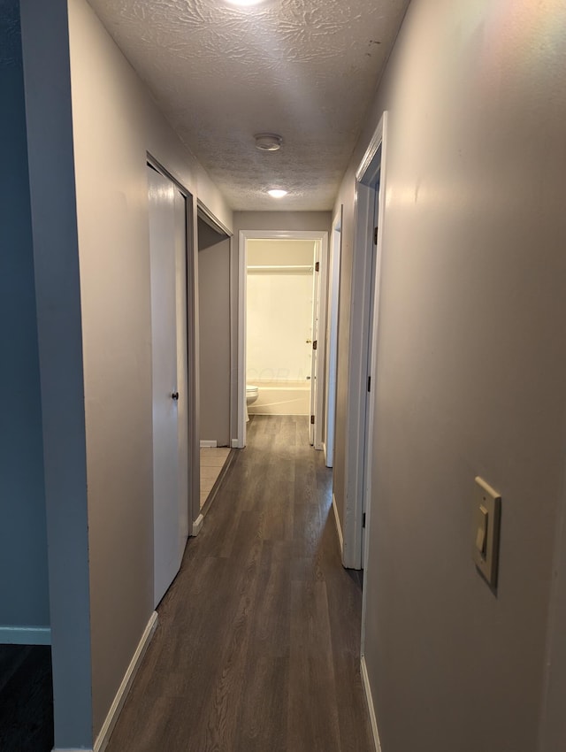 6679 Brock St, Dublin, OH 43017 - hall with dark wood finished floors and a textured ceiling