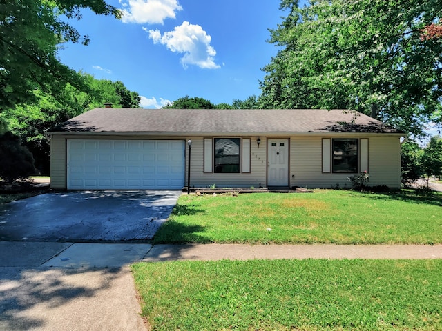 6679 Brock St, Dublin, OH 43017 - single story home with a front yard, asphalt driveway, and a garage