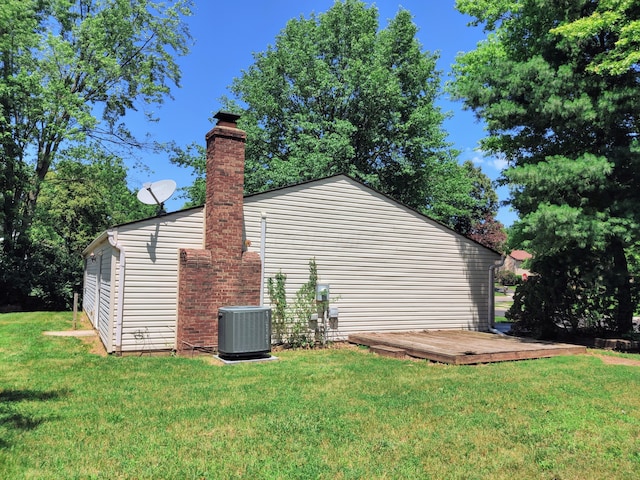 6679 Brock St, Dublin, OH 43017 - view of property exterior with a lawn, a chimney, and a wooden deck