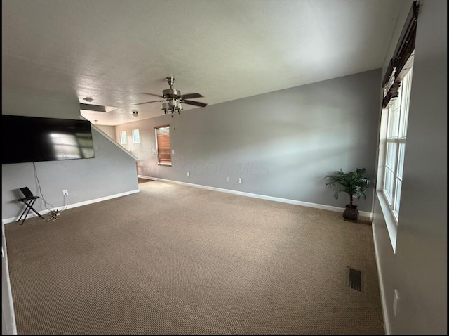 7173 Serenoa Dr, Reynoldsburg, OH 43068 - unfurnished living room with a ceiling fan, carpet floors, and plenty of natural light