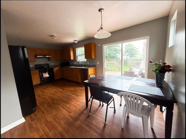 7173 Serenoa Dr, Reynoldsburg, OH 43068 - dining area with dark wood-style floors and baseboards