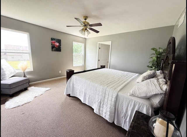7173 Serenoa Dr, Reynoldsburg, OH 43068 - carpeted bedroom with baseboards and ceiling fan