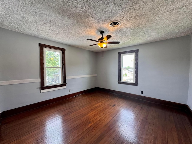940 W 3rd St, Logan, OH 43138 - spare room featuring dark wood-style floors, ceiling fan, and a textured ceiling